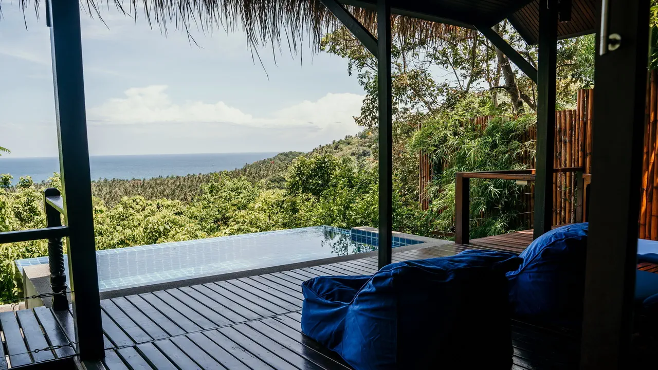 Spacious luxury pool villa interior with open-plan living in Koh Tao